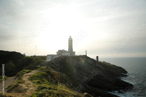 Lighthouse on top of a cliff by the sea. Santander, Cantabria, Spain