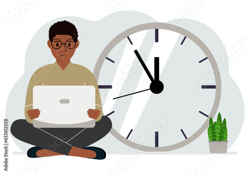 A man sits cross-legged and holds a laptop. Next to the big clock. Time management concept, little time, much time, deadline.