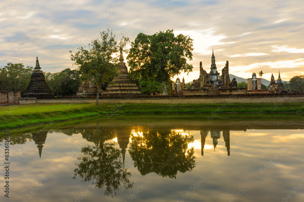 Ruins of the temple of Wat Mahathat Temple in the precinct of Sukhothai Historical Park, a UNESCO World Heritage Site, Evening in the historical park of Sukhothai city. Thailand