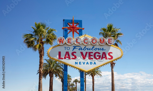 Welcome to Fabulous Las Vegas Nevada Sign. Palm tree behind neon billboard, USA casino, blue sky.