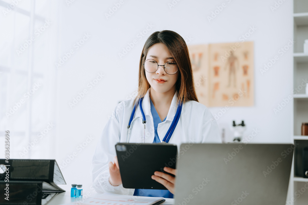 Medicine Asian doctor hand working with modern digital tablet computer interface as medical network concept Medicine Asian doctor hand working with modern digital tablet computer interface as medical network concept