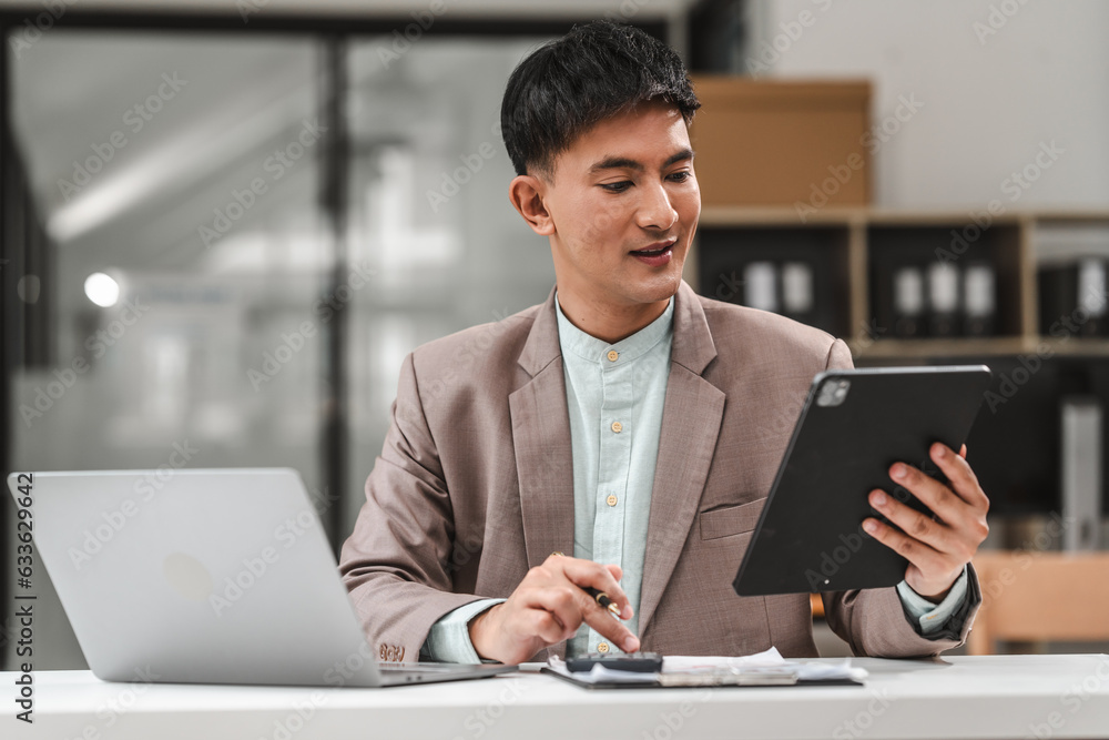 Using tablet pc, Asian business asian man supervisor analyse financial report of responsible worker pay attention on mistakes propose correction. Using tablet pc, Asian business asian man supervisor analyse financial report of responsible worker pay attention on mistakes propose correction.