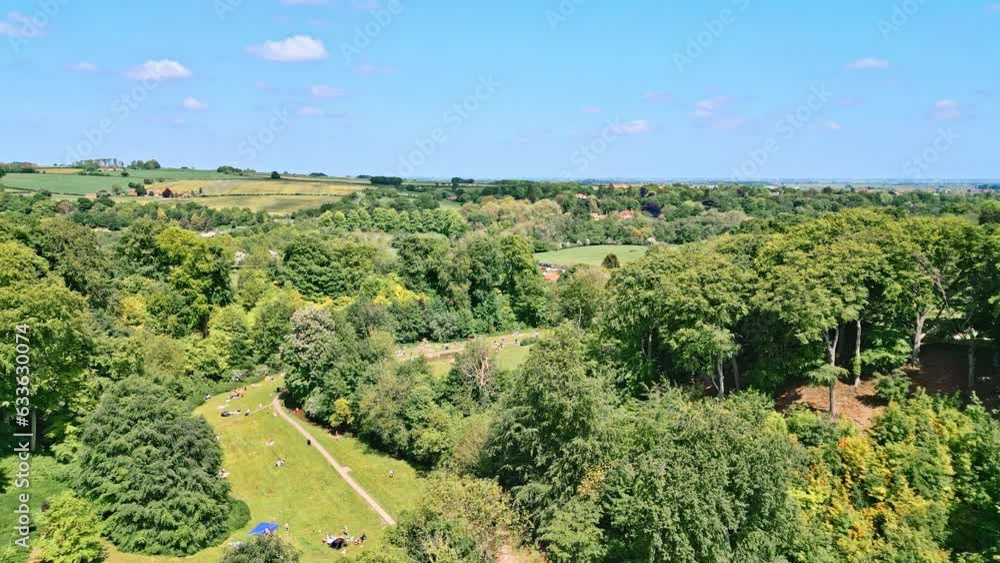 A British countryside park seen from drone. People enjoy winding stream, beautiful picnic spots. Woodland site: Hubbard's Hills, by Louth, Lincolnshire. A British countryside park seen from drone. People enjoy winding stream, beautiful picnic spots. Woodland site: Hubbard's Hills, by Louth, Lincolnshire.