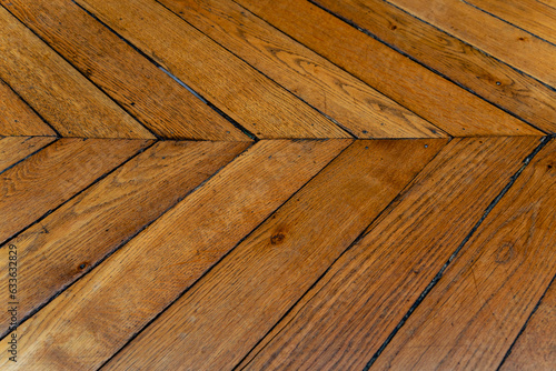 wood planks from an old fishtail parquet floor 