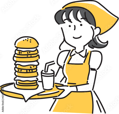大きなハンバーガーのセットを運ぶ女性店員