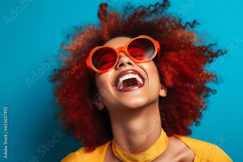Vintage Vibes: Friends Laughing and Smiling Against Blue Background. Black Arts Movement Influence with Colorful, Eye-Catching Composition. Light Indigo and Amber Tones. High-Angle Capture