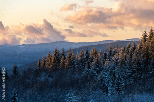 Golden hour with winter view on Sumava mountains