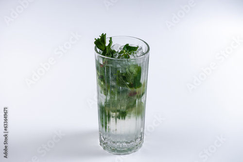 mojito cocktail with lime and mint in glass on white background