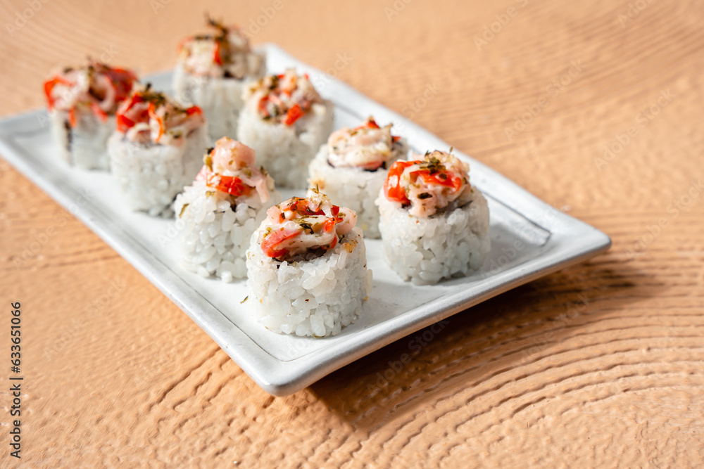 sushi is a Japanese dish of prepared vinegared rice, usually with some sugar and salt, accompanied by a variety of ingredients such as seafood, often raw and vegetables. sushi is a Japanese dish of prepared vinegared rice, usually with some sugar and salt, accompanied by a variety of ingredients such as seafood, often raw and vegetables.