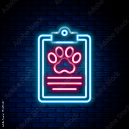 Glowing neon line Clipboard with medical clinical record pet icon isolated on brick wall background. Health insurance form. Medical check marks report. Colorful outline concept. Vector