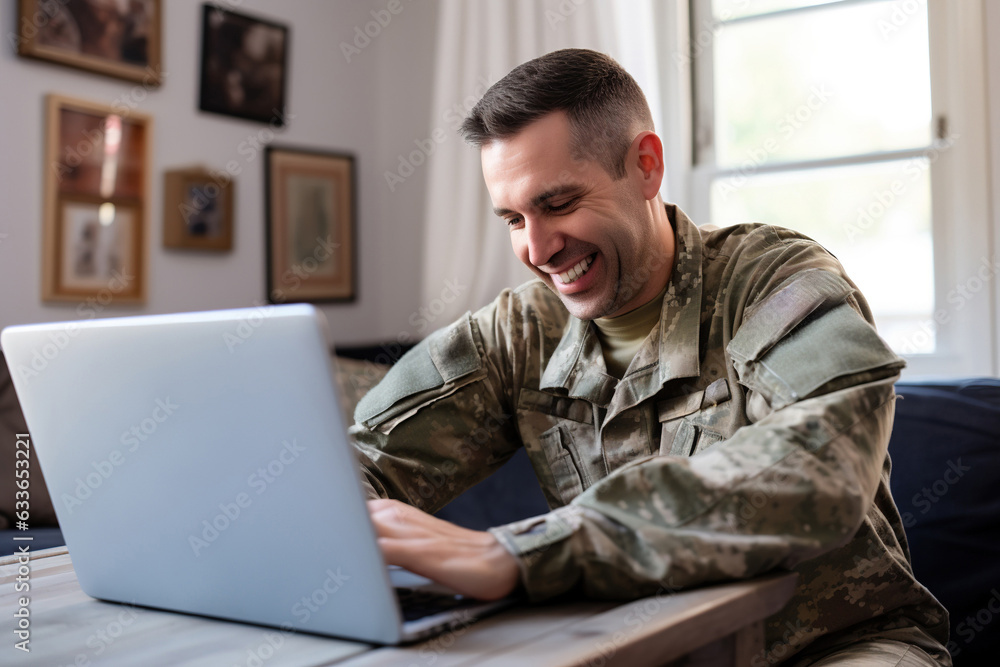 Patriotic male soldier video chatting with his family on a laptop Patriotic male soldier video chatting with his family on a laptop