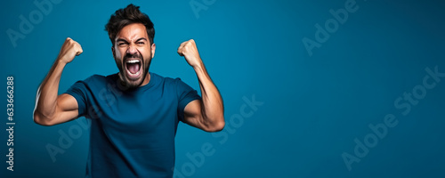 American football fan celebrating a victory on blue background with empty space for text 