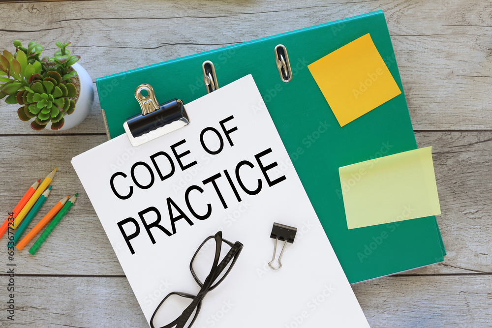 Code of Practice text on white a4 paper. green folder Stock Photo ...