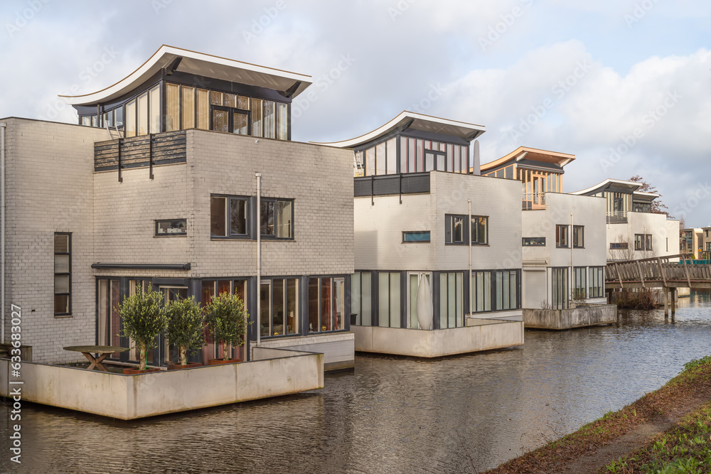 Residential area with modern architecture along the water in the Kattenbroek district in the Dutch city of Amersfoort.