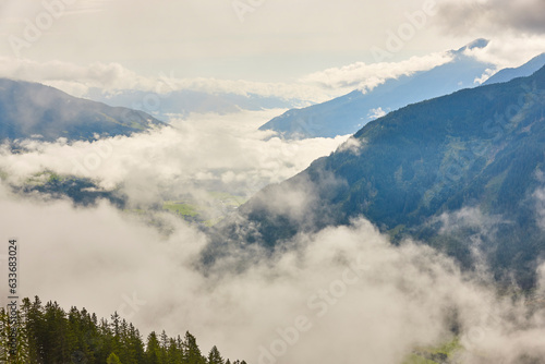Cloudy mountain and valley landscape in Salzburg region. Nature Austria