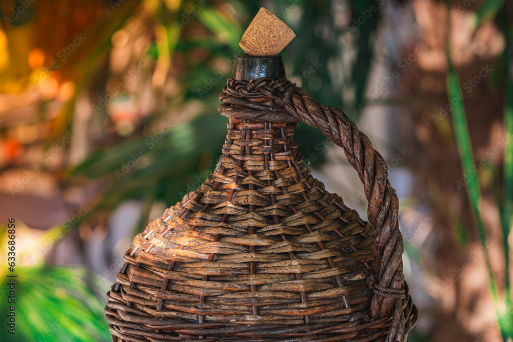 Φωτογραφία Large Vintage Wicker Wrapped Wine Bottle