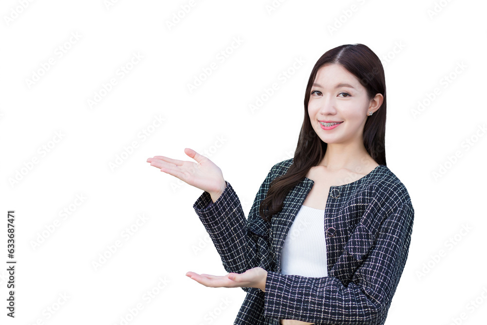 Asian professional working business woman who wears black suit with braces on teeth is pointing hand to present something while isolated on white background. Asian professional working business woman who wears black suit with braces on teeth is pointing hand to present something while isolated on white background.