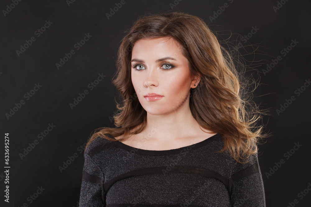 Pretty brunette model woman with makeup and brown hairstyle on black background Pretty brunette model woman with makeup and brown hairstyle on black background