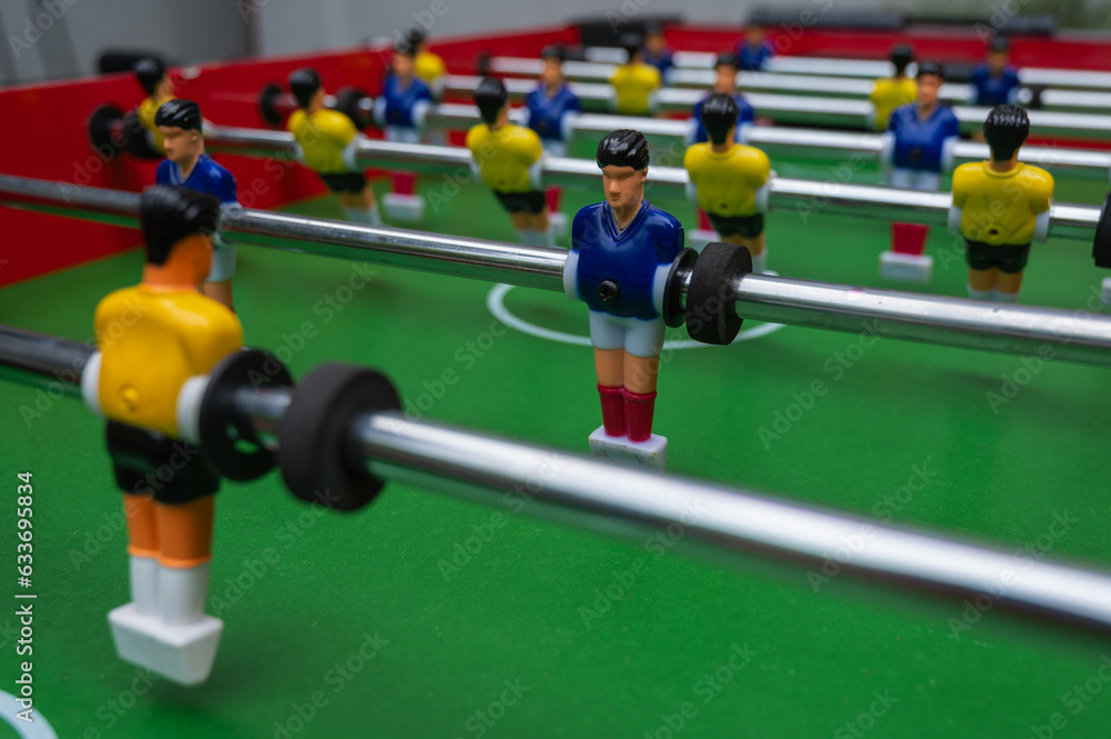 table football (table football) football match, aka kicker. Abstract light, close-up view, top view table football (table football) football match, aka kicker. Abstract light, close-up view, top view