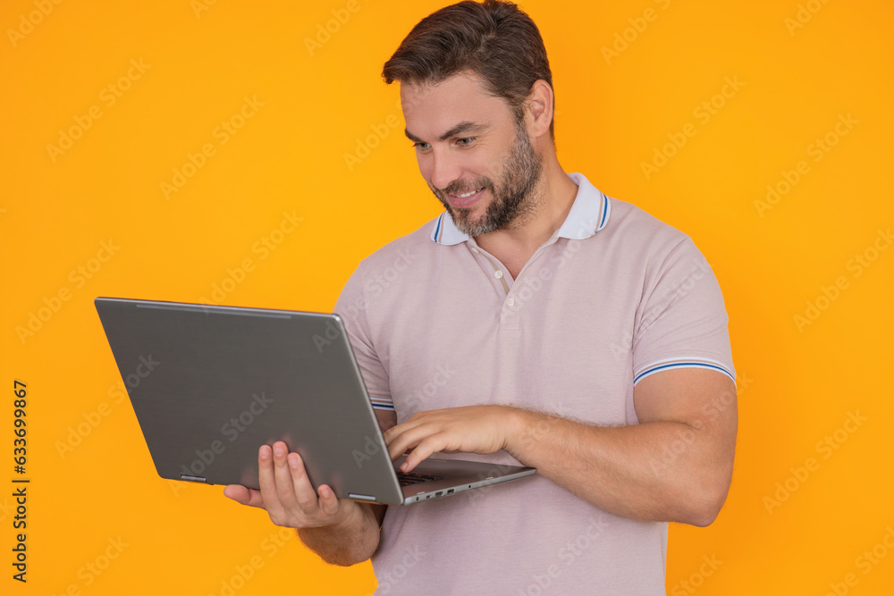 Freelancer man working on laptop in studio. Man freelancer checking laptop. Serious freelancer writing text on laptop. Male freelancer employee using laptop. Freelance and business. Freelancer man working on laptop in studio. Man freelancer checking laptop. Serious freelancer writing text on laptop. Male freelancer employee using laptop. Freelance and business.