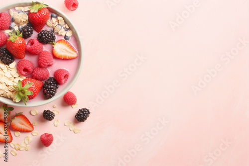Top view of cereal and berry fruit bowl with copy space