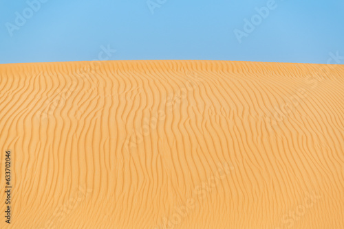 Lonely Golden Sand Dunes Under Bright Blue Sky. Desert Landscape