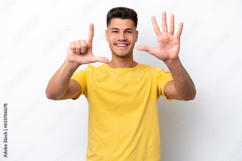 Young caucasian man isolated on white background counting seven with fingers Young caucasian man isolated on white background counting seven with fingers