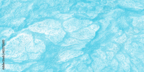 Blue water texture. Water waves in sunlight. water background. Blue colored clear calm water surface texture with splashes and bubbles. Trendy abstract nature background.