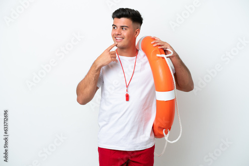 Young handsome man isolated on white background with lifeguard equipment and thinking an idea while looking side