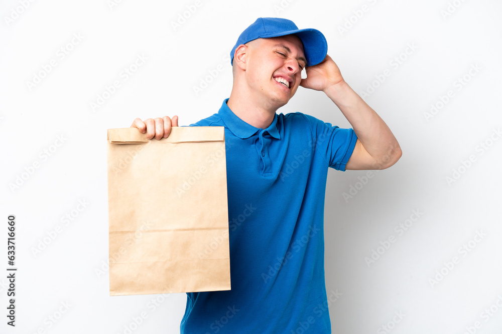 Young Brazilian man taking a bag of takeaway food isolated on white background smiling a lot Young Brazilian man taking a bag of takeaway food isolated on white background smiling a lot