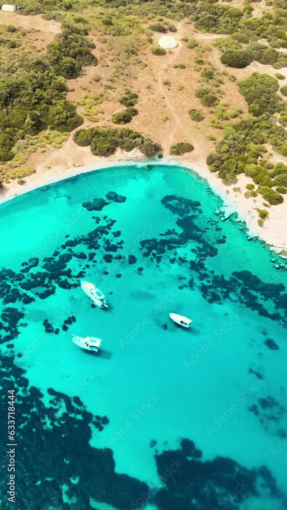Aerial vertical shot of crystal water sea lagoon with yachts on Aegean sea in Bodrum, Turkey Aerial vertical shot of crystal water sea lagoon with yachts on Aegean sea in Bodrum, Turkey