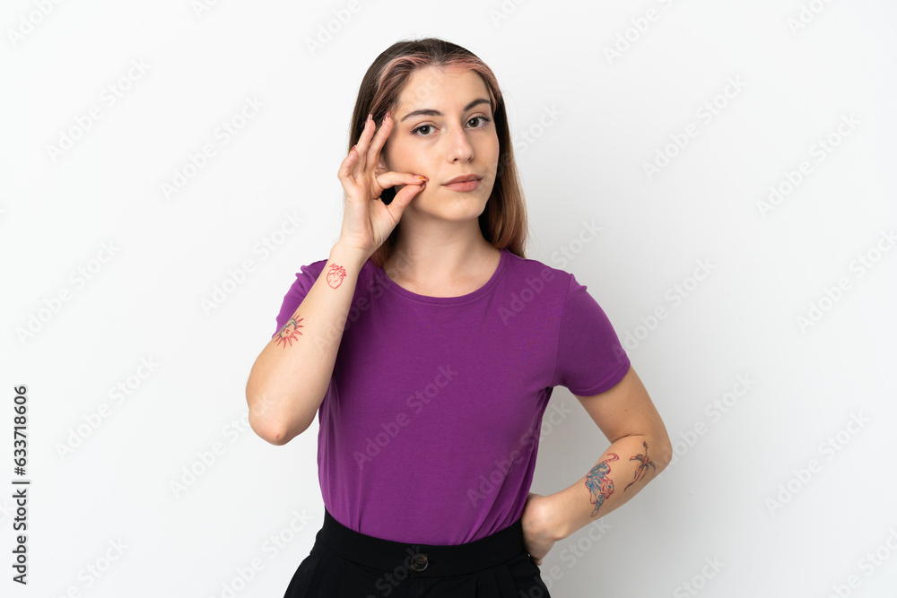 Young caucasian woman isolated on white background showing a sign of silence gesture Young caucasian woman isolated on white background showing a sign of silence gesture