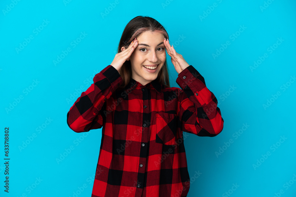 Young caucasian woman isolated on blue background with surprise expression Young caucasian woman isolated on blue background with surprise expression