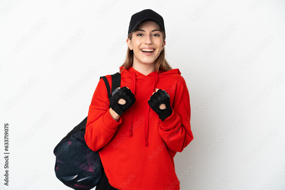 Young sport woman with sport bag isolated on white background celebrating a victory in winner position Young sport woman with sport bag isolated on white background celebrating a victory in winner position