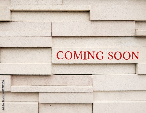 Wall with text COMING SOON, to inform something imteresting will be arriving in the near future