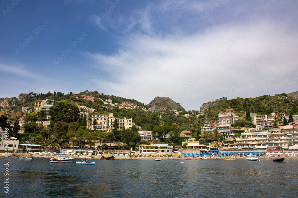 A view of Taormina from the bay with beach scenery