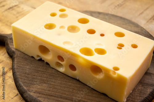 Tableau sur toile Cheese collection, french hard cheese with holes emmentaler close up