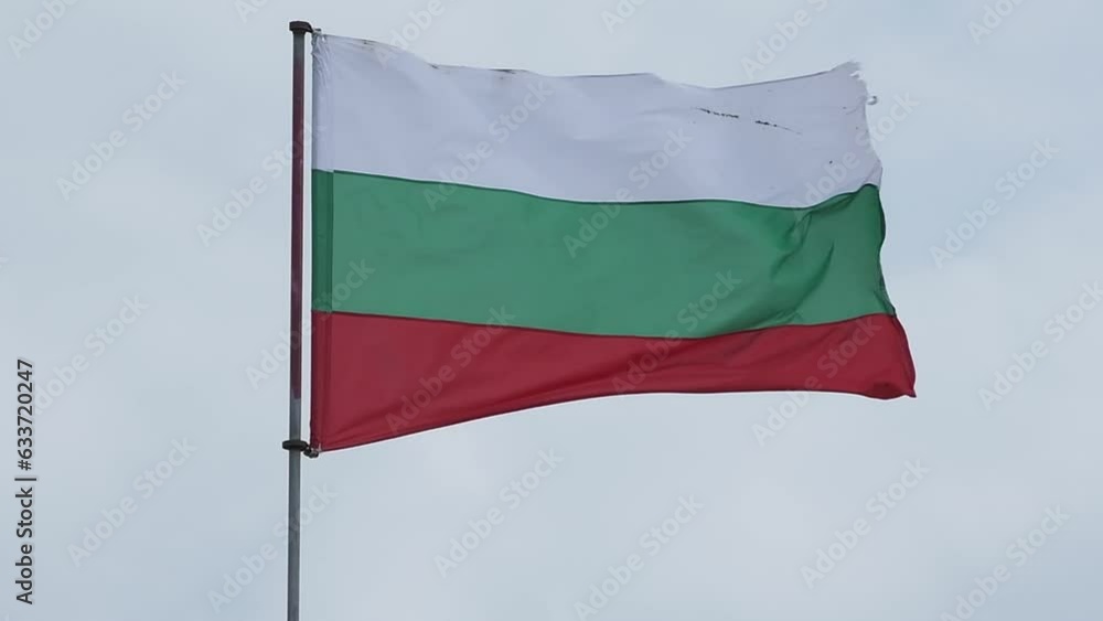 The flag of Bulgaria against the background of the sky with clouds sways in the wind. The flag of Bulgaria against the background of the sky with clouds sways in the wind.