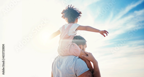 Obraz na plátně Kid on father shoulders, blue sky and family with travel, back view and freedom with fun together outdoor