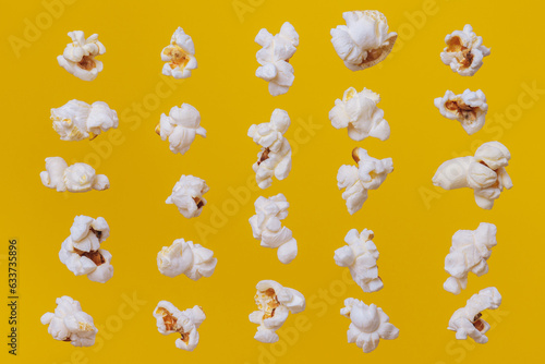 Close up of popcorn on yellow background. Food pattern.