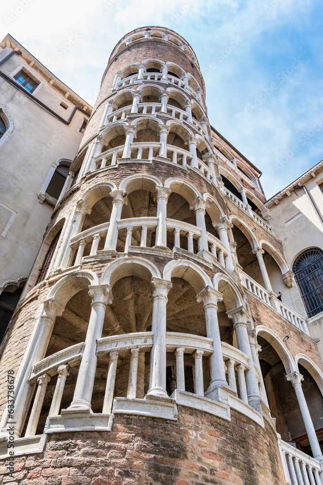 View with the facade and the spiral staircase (scala) of Palazzo Contarini del Bovolo in Venice, Italy.