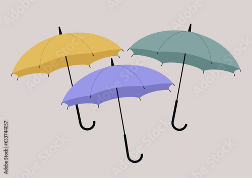 A set of cotton candy colored umbrellas, a seasonal weather concept