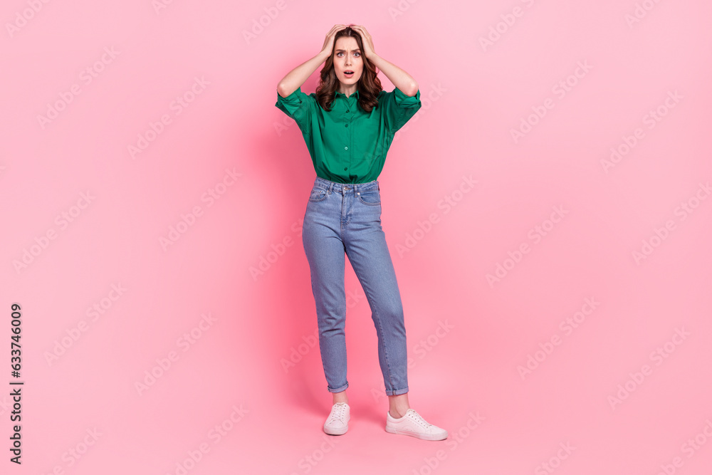 Full size portrait of impressed speechless girl arms touch head staring cant believe isolated on pink color background Full size portrait of impressed speechless girl arms touch head staring cant believe isolated on pink color background