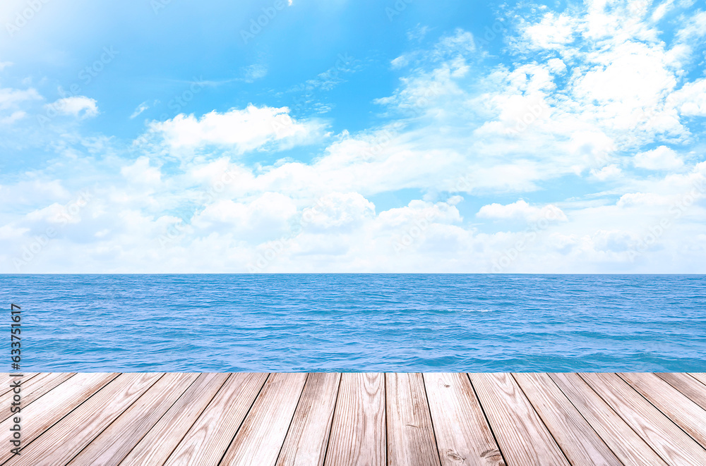 Fototapeta premium Empty wooden table for displaying products. The background is sea view, blue sky, white clouds. (with copy space) 
