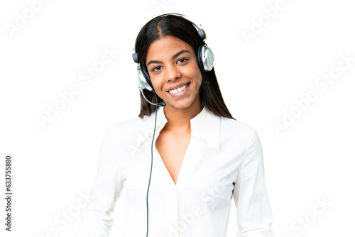 Telemarketer African American woman working with a headset over isolated chroma key background laughing