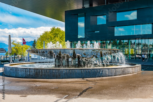 Lovely view of the famous fountain Wagenbach-Brunnen on Europaplatz with the Lucerne Culture and Congress Center in the back. The imposing fountain was built in 1934 by the architect Armin Meili. photo