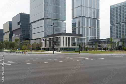 empty asphalt road in modern city with office buildings as background.