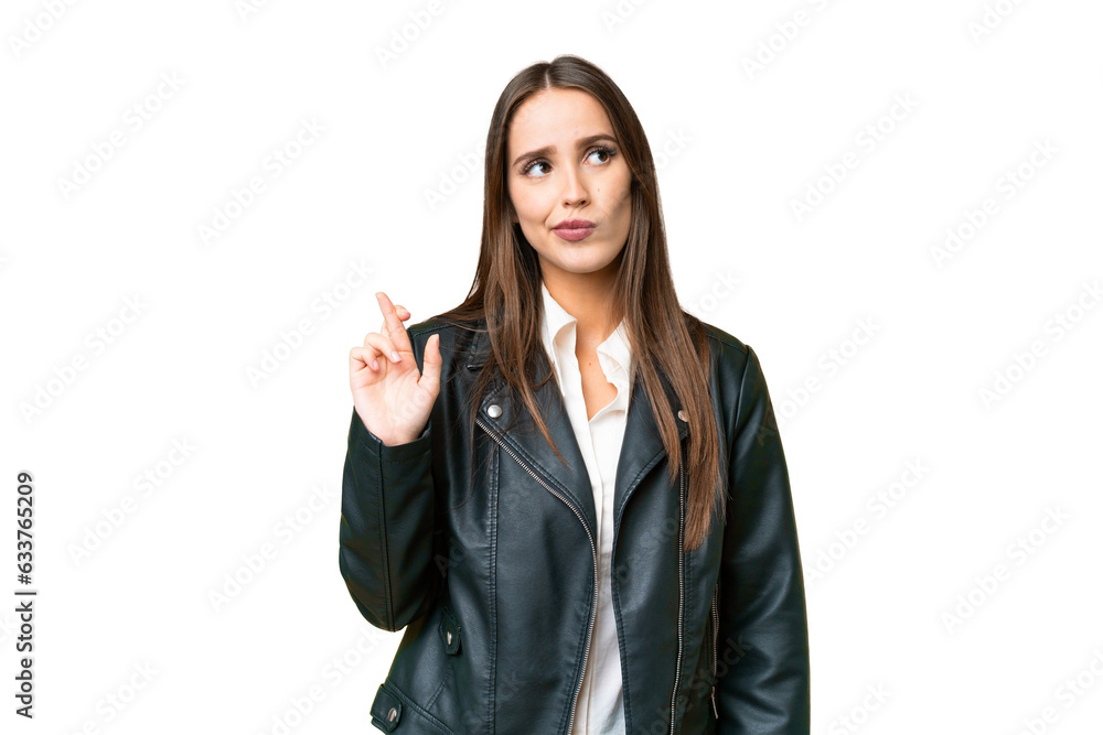 Young beautiful woman over isolated chroma key background with fingers crossing and wishing the best Young beautiful woman over isolated chroma key background with fingers crossing and wishing the best