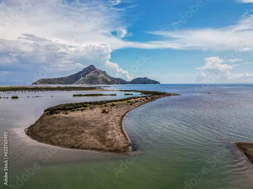 Aerial photo of Dioni beach, a hidden beach were the Ionian sea meets the Corithian Gulf with the sea at one side and the estuary of Acheloos river on the other side of the beach