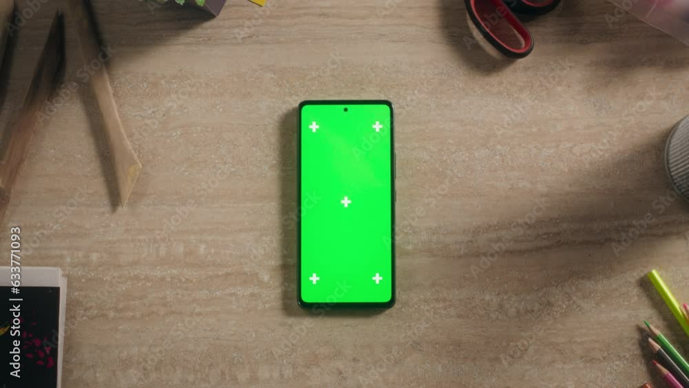 Top Down View of a Smartphone with Mock Up Green Screen Display. Zoom ...